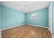 Bedroom with a neutral paint, wood-look flooring, and a ceiling fan at 125 Ole Cedar Ln., Conway, SC 29526