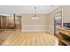 A dining room featuring a vintage chandelier and views to the front and side yards at 125 Ole Cedar Ln., Conway, SC 29526