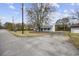 Charming home with an overhanging tree in the front yard at 125 Ole Cedar Ln., Conway, SC 29526