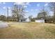 Home and garage with basketball hoop situated on a spacious lot at 125 Ole Cedar Ln., Conway, SC 29526