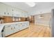 Eat-in kitchen featuring plenty of counter space, lots of cabinetry and wood-look flooring at 125 Ole Cedar Ln., Conway, SC 29526