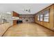 Bright living room featuring hardwood floors, brick fireplace, and large windows at 125 Ole Cedar Ln., Conway, SC 29526