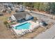 A refreshing community pool with lounge chairs for relaxation at 129 Tomoka Trail, Longs, SC 29568