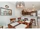 Open dining area with seating, pendant lighting, and easy access to the adjacent kitchen at 129 Tomoka Trail, Longs, SC 29568