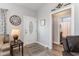 Inviting foyer with a decorative front door, wood-look floors, and easy access to the bathroom at 129 Tomoka Trail, Longs, SC 29568