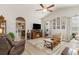 Comfortable living room area featuring a fireplace, neutral walls, modern flooring, and an open layout at 129 Tomoka Trail, Longs, SC 29568