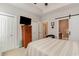 Comfortable bedroom with a barn door leading to the ensuite bathroom at 129 Tomoka Trail, Longs, SC 29568