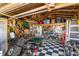 Interior view of the shed showcasing ample storage and a checkered floor at 129 Tomoka Trail, Longs, SC 29568