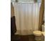 Cozy bathroom featuring a shower with a white shower curtain at 1298 River Oaks Dr. # 5-F, Myrtle Beach, SC 29579