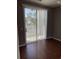 Bedroom with hardwood floors and a sliding glass door leading to the outside at 1298 River Oaks Dr. # 5-F, Myrtle Beach, SC 29579