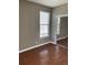 Bedroom with hardwood floors, a window, and a closet with mirrored doors at 1298 River Oaks Dr. # 5-F, Myrtle Beach, SC 29579