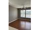 Inviting living room featuring sleek laminate floors, neutral paint, and large bright windows at 1298 River Oaks Dr. # 5-F, Myrtle Beach, SC 29579