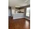 View of the living room showcasing laminate floors that seamlessly transition into the kitchen at 1298 River Oaks Dr. # 5-F, Myrtle Beach, SC 29579