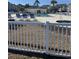 Community pool area featuring a large pool, hot tub, and plenty of seating at 1298 River Oaks Dr. # 5-F, Myrtle Beach, SC 29579