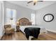 Cozy bedroom featuring a decorative chair, circle mirror, and plush pillows at 140 Northside Dr., Little River, SC 29566