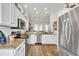 Stylish kitchen with stainless steel appliances, granite countertops, and classic white cabinets at 140 Northside Dr., Little River, SC 29566