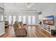 Open-concept living area with hardwood floors and a view of a TV on a console with storage at 140 Northside Dr., Little River, SC 29566