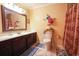 Well-lit bathroom featuring a vanity with a sink and a shower with curtain at 1456 Baldwin Ct. # 1456, Little River, SC 29566