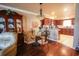 Elegant dining area adjacent to the kitchen, featuring a glass table and decorative chandelier at 1456 Baldwin Ct. # 1456, Little River, SC 29566