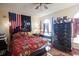 Charming main bedroom with a four poster bed, decorative flag, and wood dresser at 1456 Baldwin Ct. # 1456, Little River, SC 29566