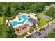 Aerial shot of community amenities featuring a large pool, playground, barn clubhouse, and basketball court at 162 Mountain Ash Ln., Myrtle Beach, SC 29579