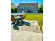 Cozy backyard patio with outdoor seating, a lush lawn, and white picket fencing at 162 Mountain Ash Ln., Myrtle Beach, SC 29579