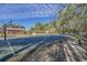 Community basketball court with a view of a barn and mature trees surrounding the area at 162 Mountain Ash Ln., Myrtle Beach, SC 29579