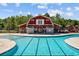 Stunning view of community pool featuring a red barn pool house with lap lanes at 162 Mountain Ash Ln., Myrtle Beach, SC 29579