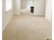 Open living room with beige carpeting, a window with blinds and an open floor plan at 162 Mountain Ash Ln., Myrtle Beach, SC 29579