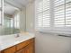 Bathroom featuring a vanity with wood cabinets and a window with natural light at 172 Hawthorn Dr., Pawleys Island, SC 29585