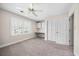 Carpeted bedroom with a window, closet, and built-in desk space at 172 Hawthorn Dr., Pawleys Island, SC 29585