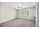 Neutral bedroom with a large window for lots of natural light and ceiling fan at 172 Hawthorn Dr., Pawleys Island, SC 29585