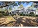 Charming one-story home with well-maintained front yard and mature trees at 172 Hawthorn Dr., Pawleys Island, SC 29585