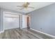 Clean bedroom featuring a closet, light grey walls, wood look floors, and a ceiling fan at 1881 Colony Dr. # 8-S, Surfside Beach, SC 29575