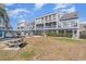 The property features a lawn for outdoor activities near a charcoal grill and picnic table at 1881 Colony Dr. # 8-S, Surfside Beach, SC 29575