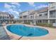 Inviting community pool surrounded by meticulously maintained landscaping, perfect for relaxation and enjoyment at 1881 Colony Dr. # 8-S, Surfside Beach, SC 29575