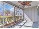 Relaxing screened porch with views of the lush landscaping and blue sky at 1881 Colony Dr. # 8-S, Surfside Beach, SC 29575