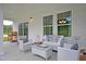 Cozy screened porch featuring outdoor seating at 2009 Lone Cypress Dr, Myrtle Beach, SC 29579