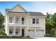 Charming two-story home with a welcoming front porch and a two-car garage at 2017 Lone Cypress Dr, Myrtle Beach, SC 29579