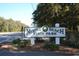 Welcoming entrance sign to Myrtle Beach State Park, inviting visitors to explore its natural beauty and trails at 2017 Lone Cypress Dr, Myrtle Beach, SC 29579