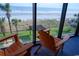 Balcony with comfortable chairs to enjoy the serene beach views at 205 74Th Ave. N # 702, Myrtle Beach, SC 29572