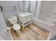 Cozy bathroom featuring wood-look flooring, a white vanity, and a shower-tub combo at 205 74Th Ave. N # 702, Myrtle Beach, SC 29572