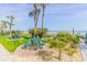 Beachfront patio featuring picnic tables, lush landscaping, and serene ocean views for outdoor relaxation at 205 74Th Ave. N # 702, Myrtle Beach, SC 29572