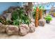 Tropical-themed lobby area featuring lush plants, rock features, and decorative tiki statues for a relaxing resort ambiance at 205 74Th Ave. N # 702, Myrtle Beach, SC 29572