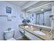 Bathroom featuring granite countertop, decorative mirror, and coordinated accessories at 2207 Ocean Blvd. S # 1217, Myrtle Beach, SC 29577