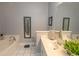 Bright and airy bathroom with a soaking tub, vanity, and decorative mirror at 2241 Waterview Dr. # 224, North Myrtle Beach, SC 29582