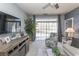 Cozy living room showcasing a large window, ceiling fan, and stylish decor accents at 2241 Waterview Dr. # 224, North Myrtle Beach, SC 29582