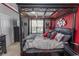 Stylish main bedroom featuring a four-poster bed, ambient lighting, and views to the outside at 2241 Waterview Dr. # 224, North Myrtle Beach, SC 29582