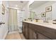 Traditional bathroom featuring double sinks, quartz countertops, and a shower/tub combo at 2321 Copper Creek Loop, Longs, SC 29568