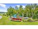 Community entrance featuring lush landscaping, palm trees, and the 'Waterside' sign at 2321 Copper Creek Loop, Longs, SC 29568